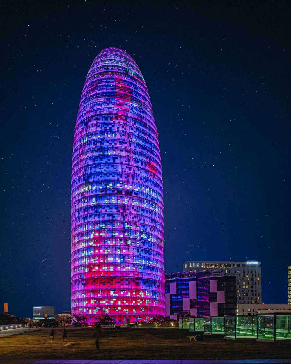 a tall building lit up in the night sky