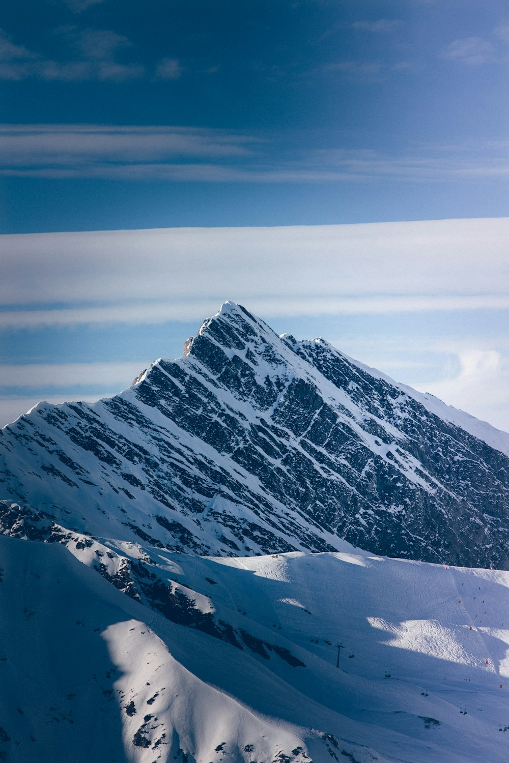 a snow covered mountain with a sky background