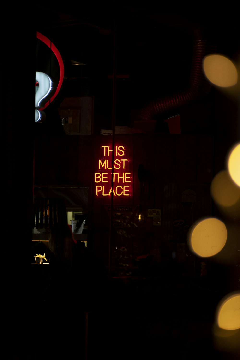 a neon sign that says it is must be the place