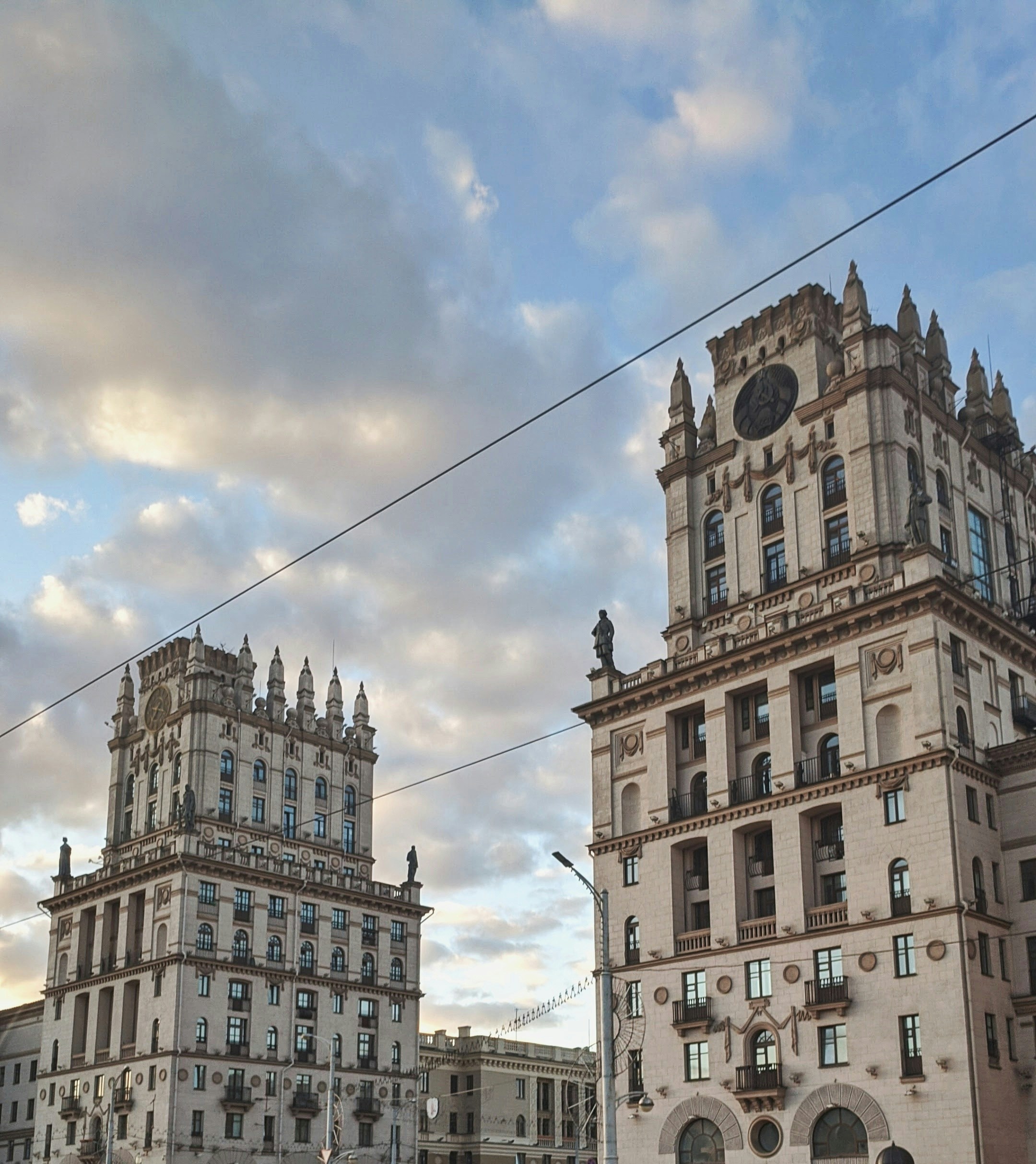 a couple of tall buildings sitting next to each other