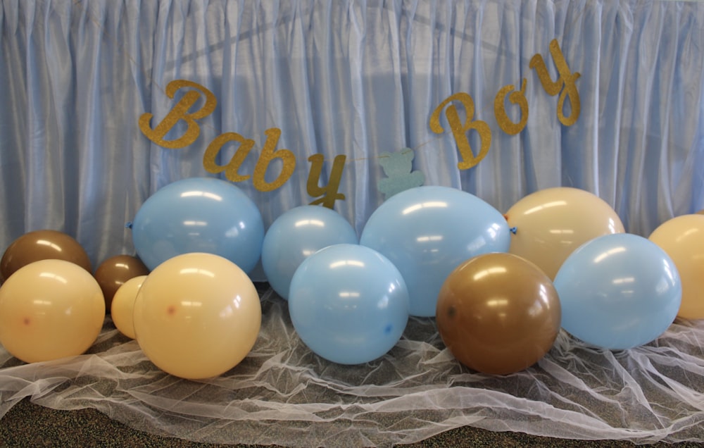 a bunch of balloons sitting on top of a table