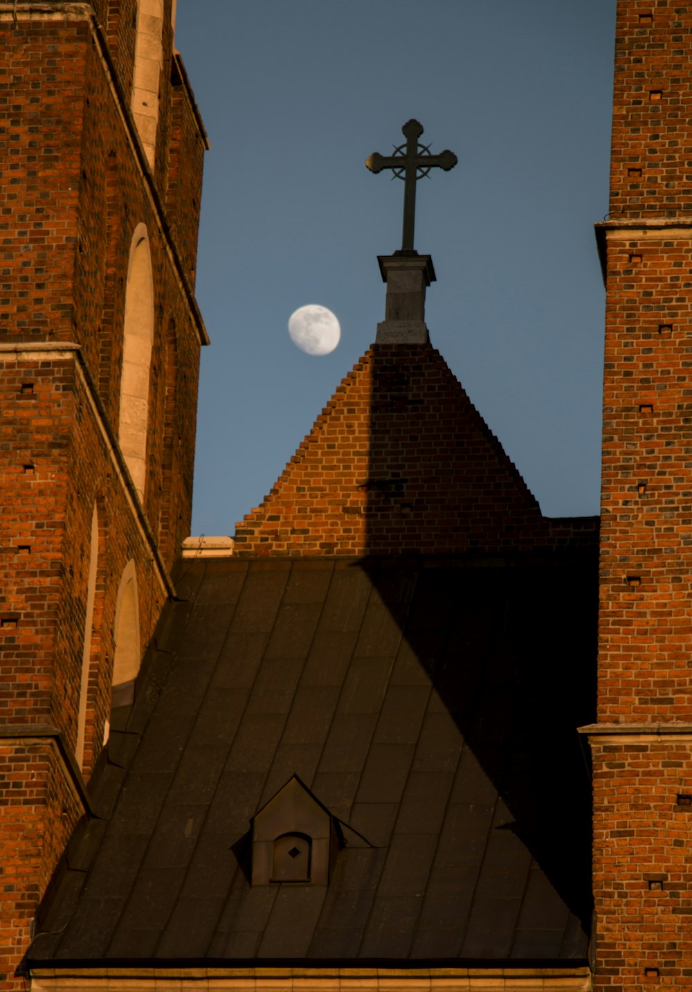 a church steeple with a cross on top of it