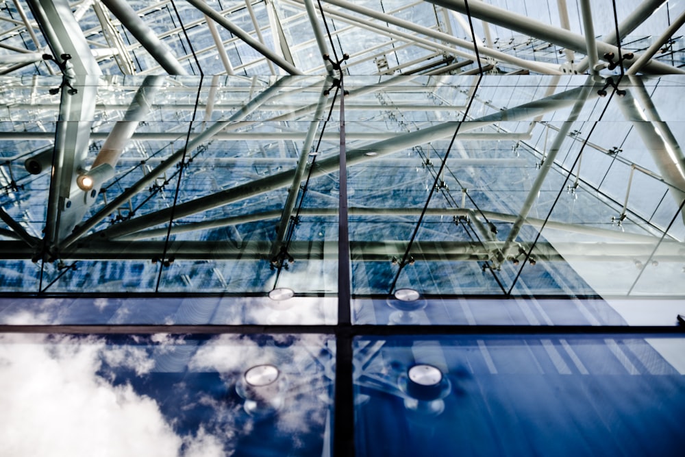 a large glass building with a sky background