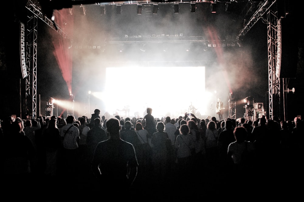 a group of people standing on top of a stage