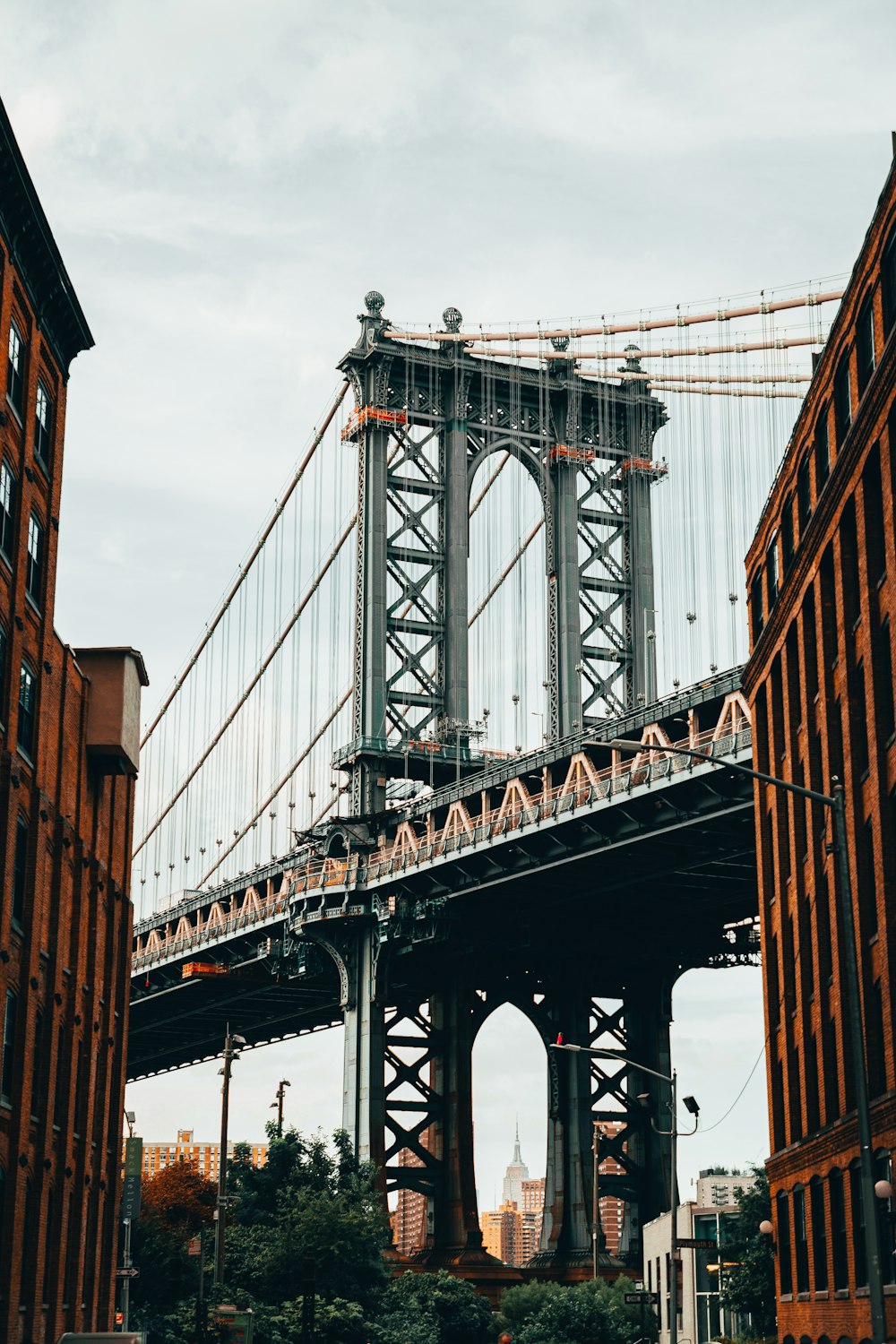 a large bridge spanning over a city with tall buildings