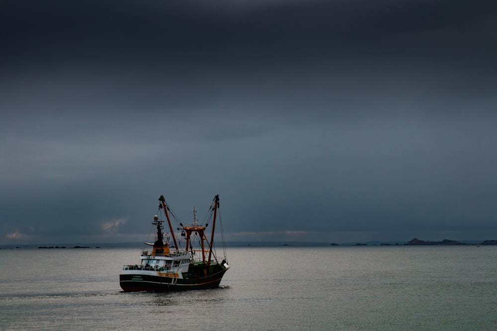 a large boat floating on top of a large body of water