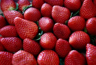 a close up of a bunch of strawberries