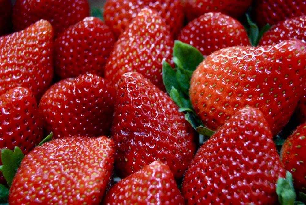 a close up of a bunch of strawberries