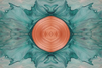 an abstract painting with a circular design in the center