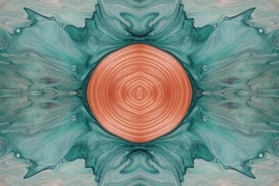 an abstract painting with a circular design in the center