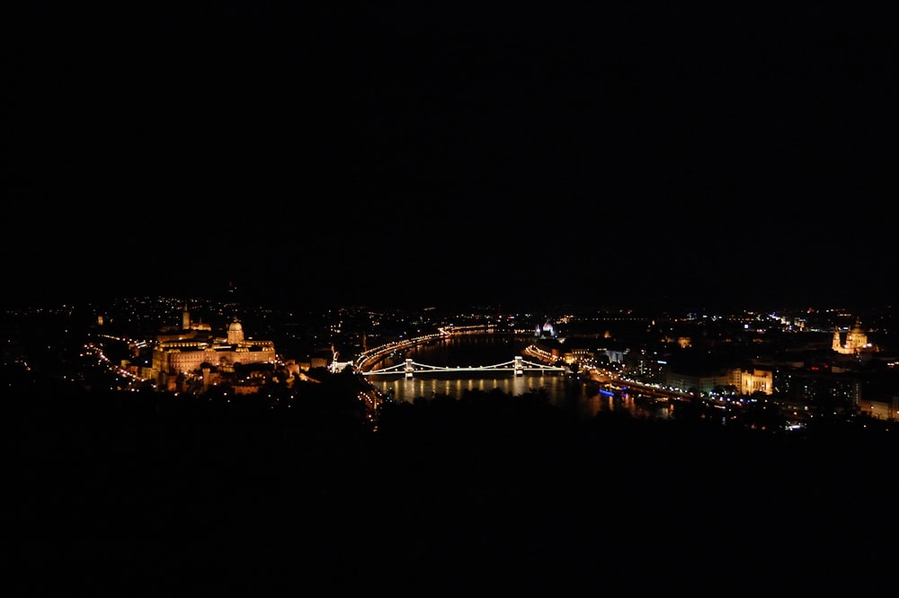 a night view of a city and a bridge