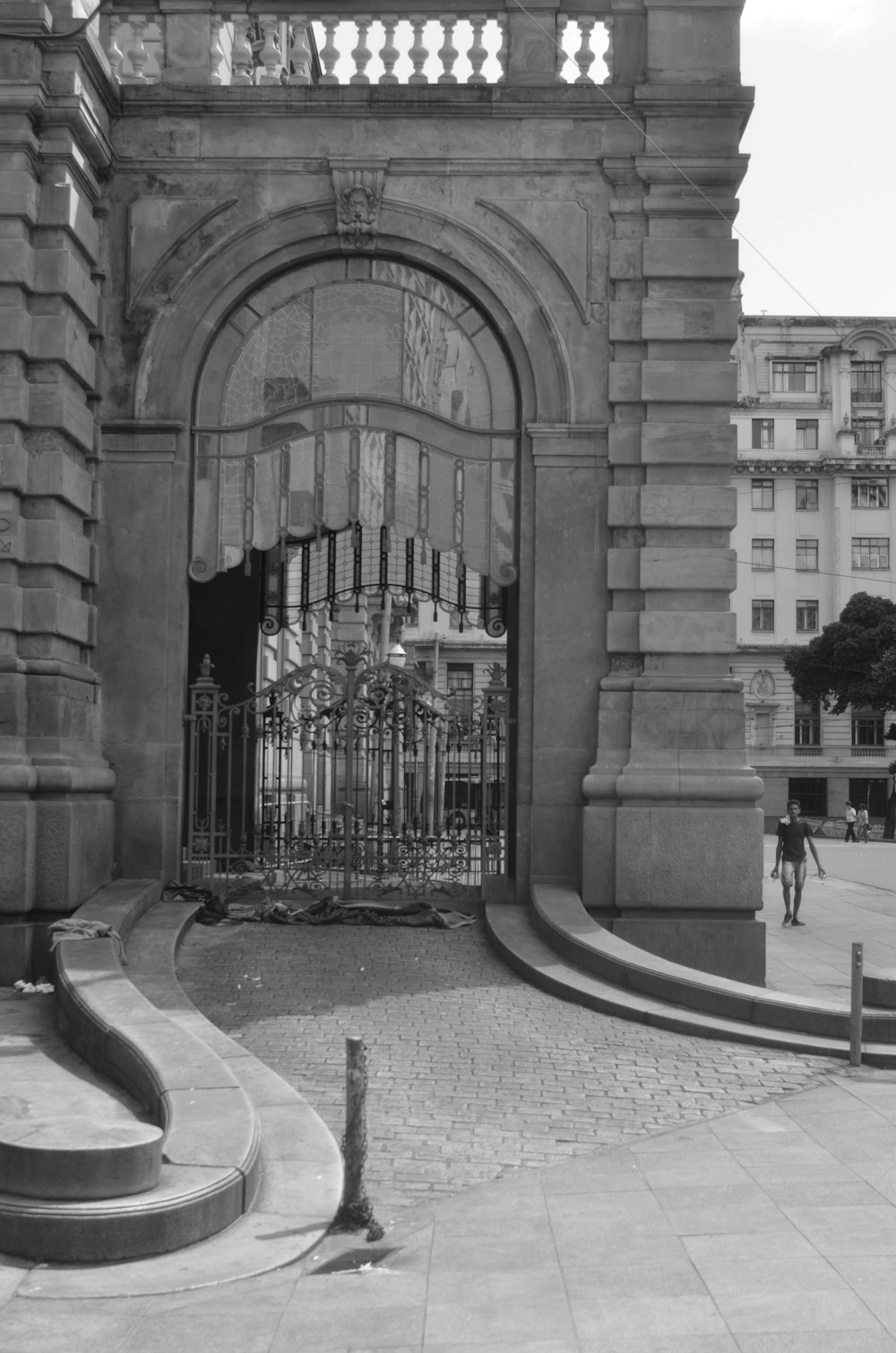 a black and white photo of a large gate
