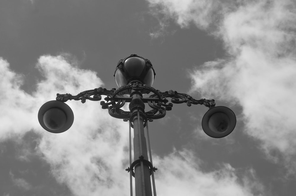 a black and white photo of a street light