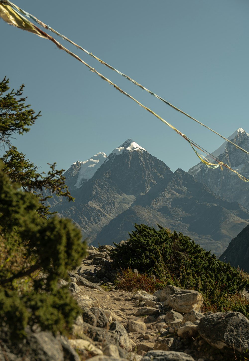 a view of a mountain range from a trail