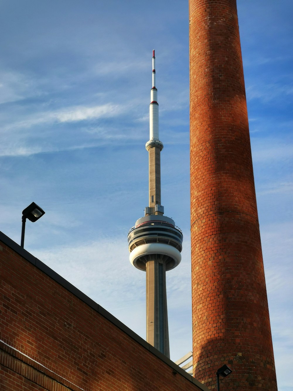 a tall brick building with a tall tower next to it