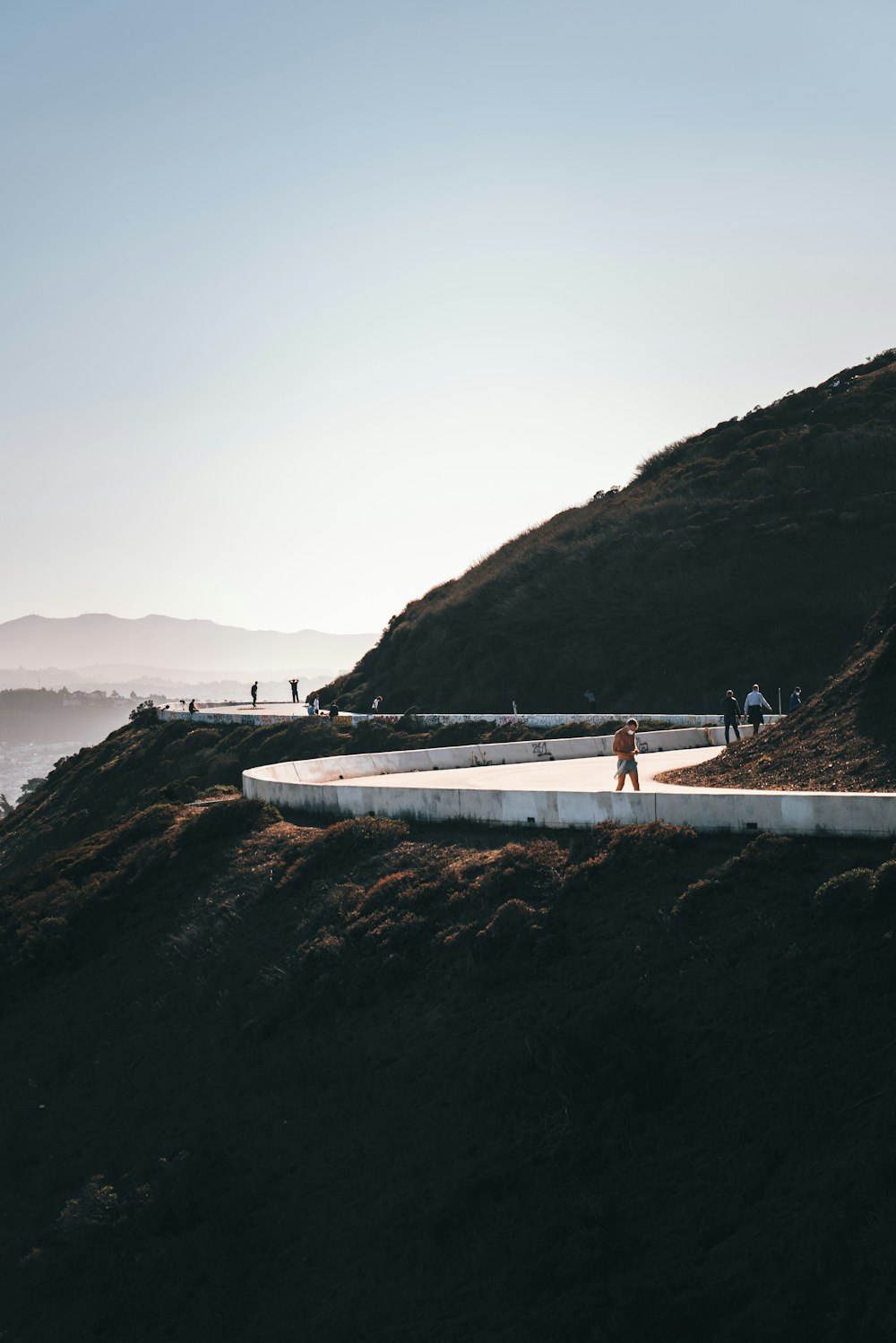 a group of people standing on top of a hill