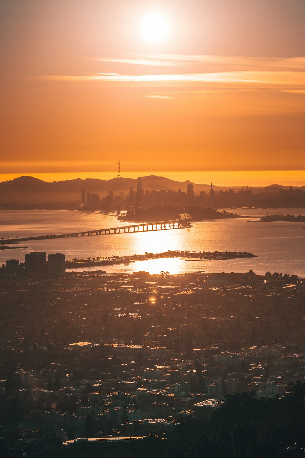 a large body of water with a bridge in the distance