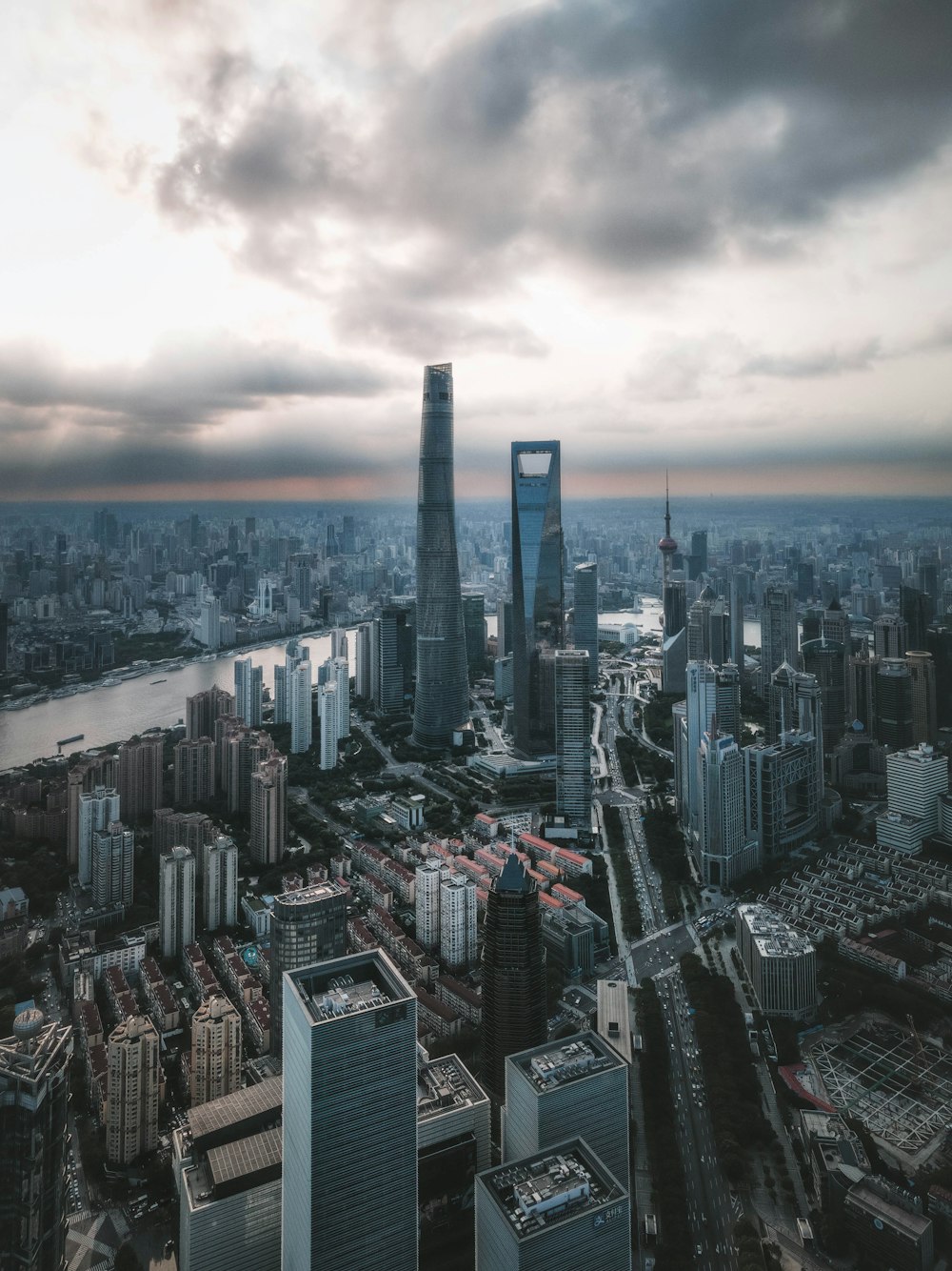 an aerial view of a city with tall buildings