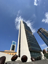 a tall building with a sky background