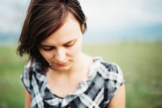 a woman holding a cell phone in her hands