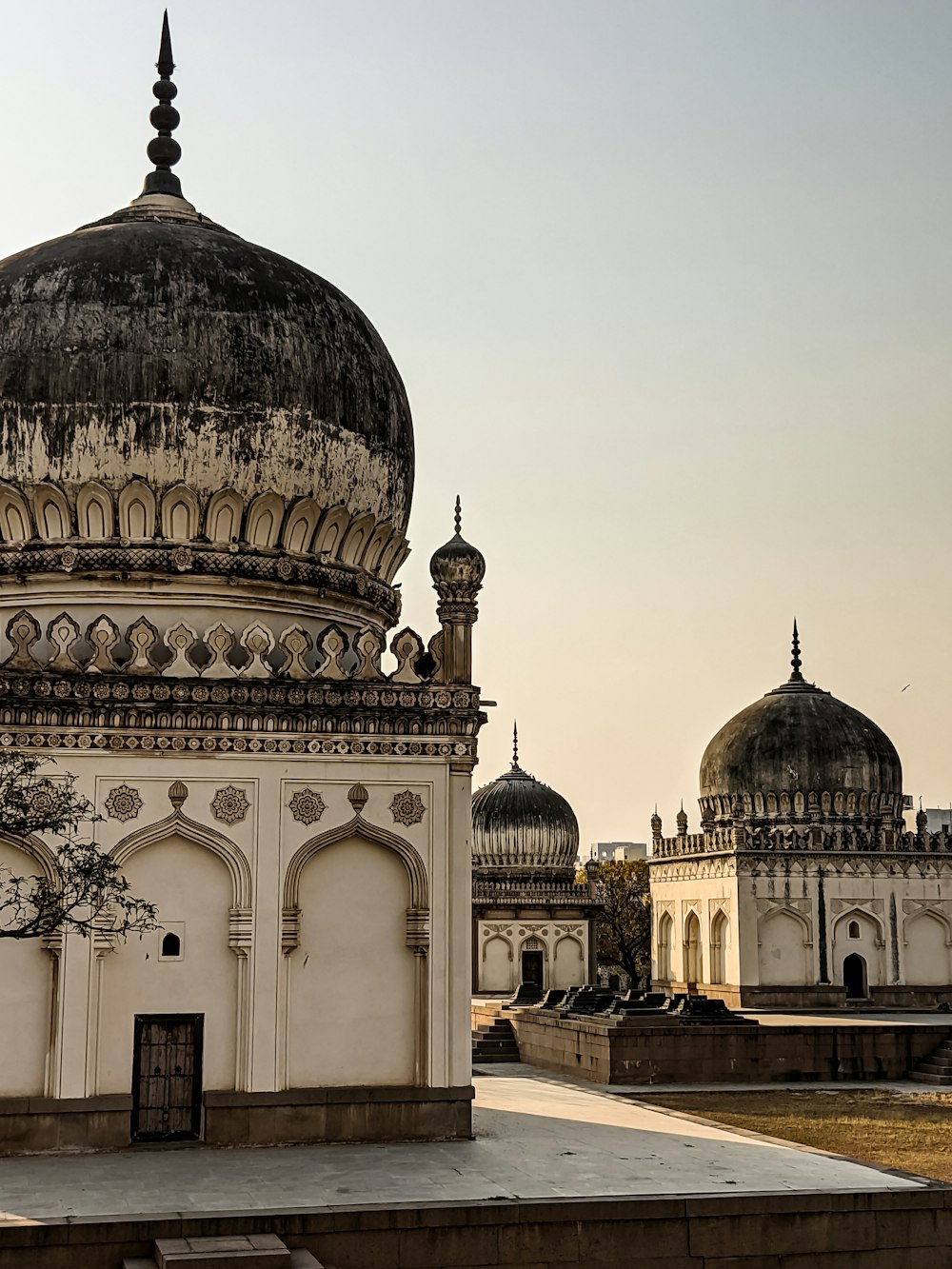 a large white building with a black dome