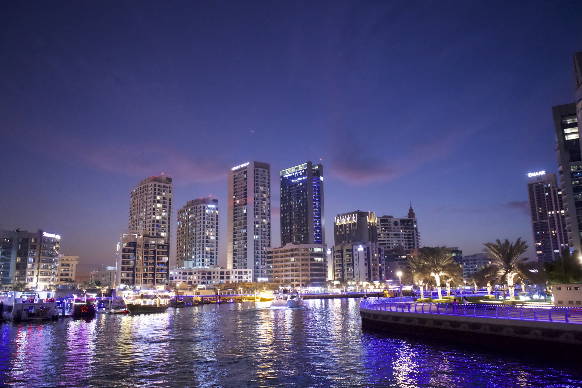 a view of a city at night from the water