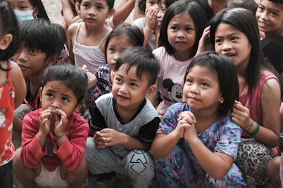 a group of children standing next to each other