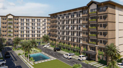 A modern condominium building with well-maintained landscaping.
