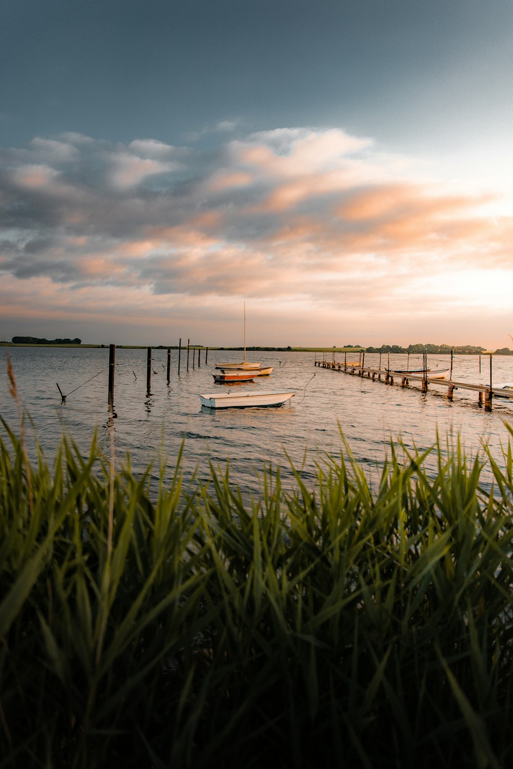 a close up of a pier next to a body of water