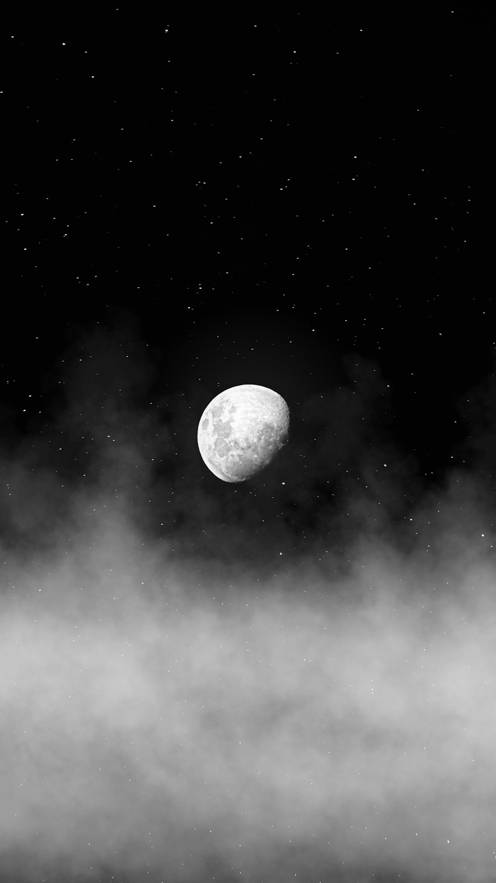 a black and white photo of the moon in the sky