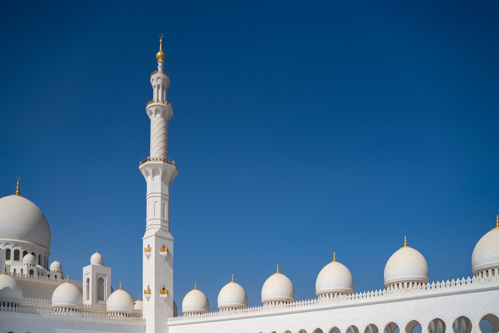 a large white building with a tall white tower