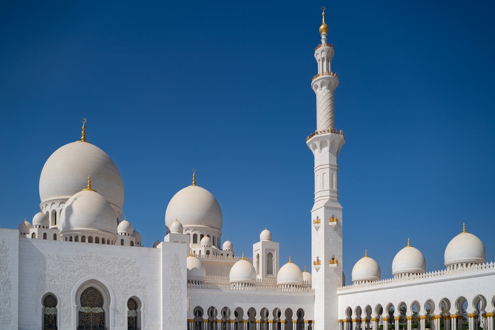 a large white building with a tall white tower