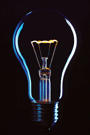 a glowing light bulb in the dark