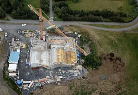 an aerial view of a construction site with a crane