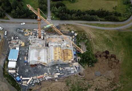 an aerial view of a construction site with a crane