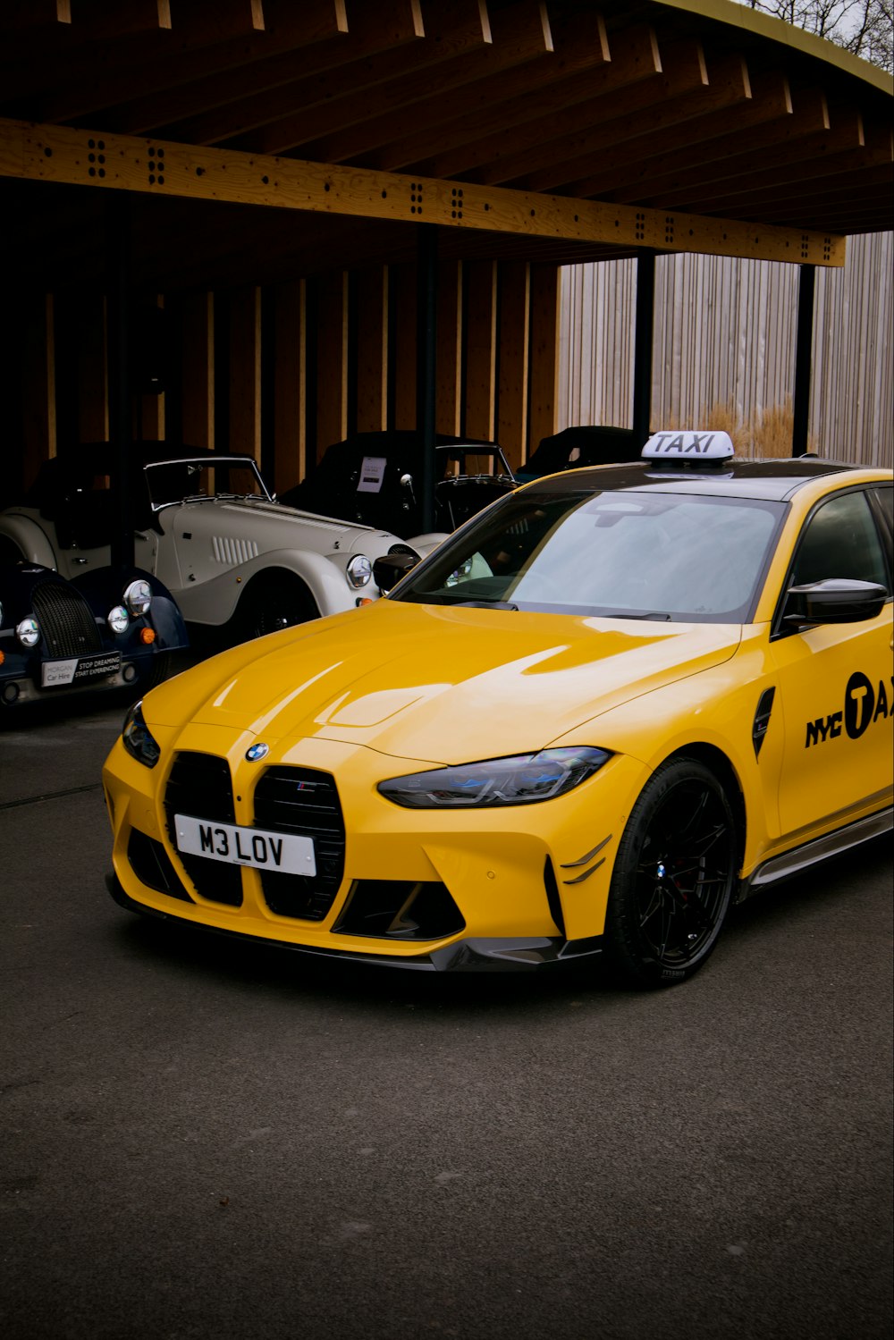 a yellow car parked in front of a building