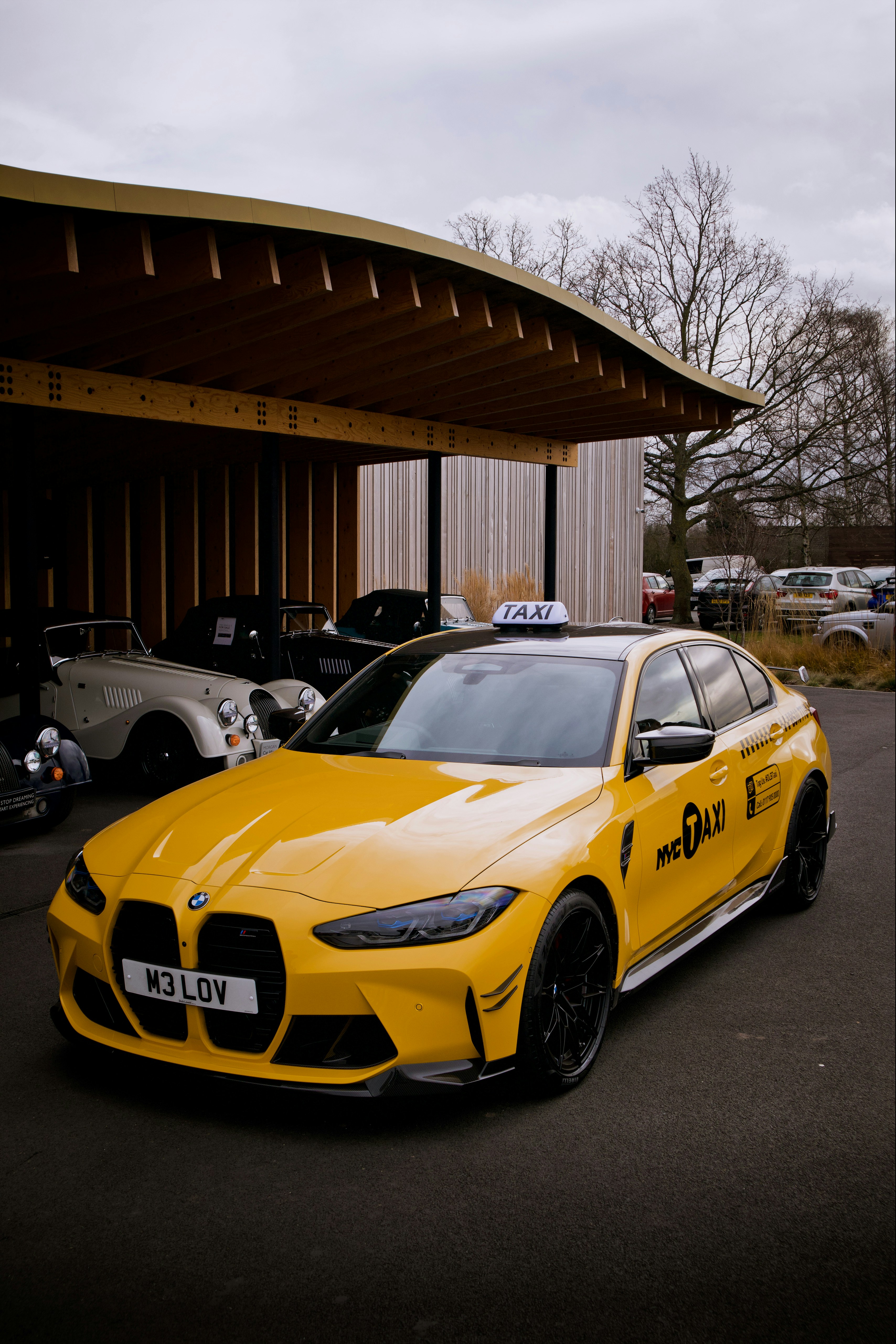 a yellow car parked in front of a building