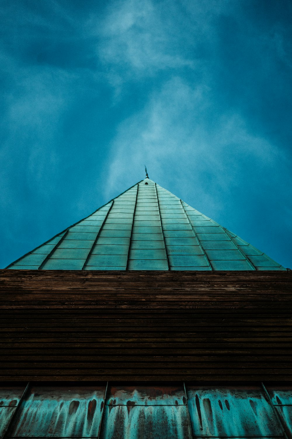 a tall building with a sky background