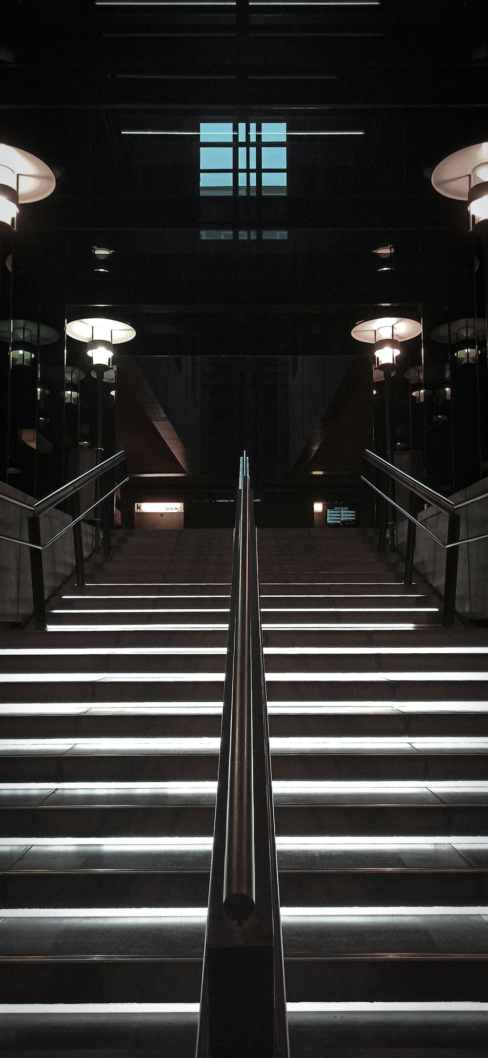 a stairway leading up to a window in a building