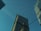 a couple of tall buildings sitting next to each other