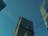 a couple of tall buildings sitting next to each other