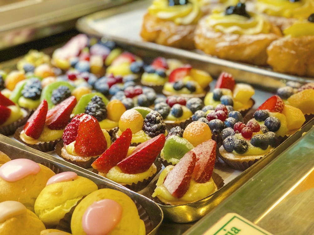 a variety of pastries and desserts are on display