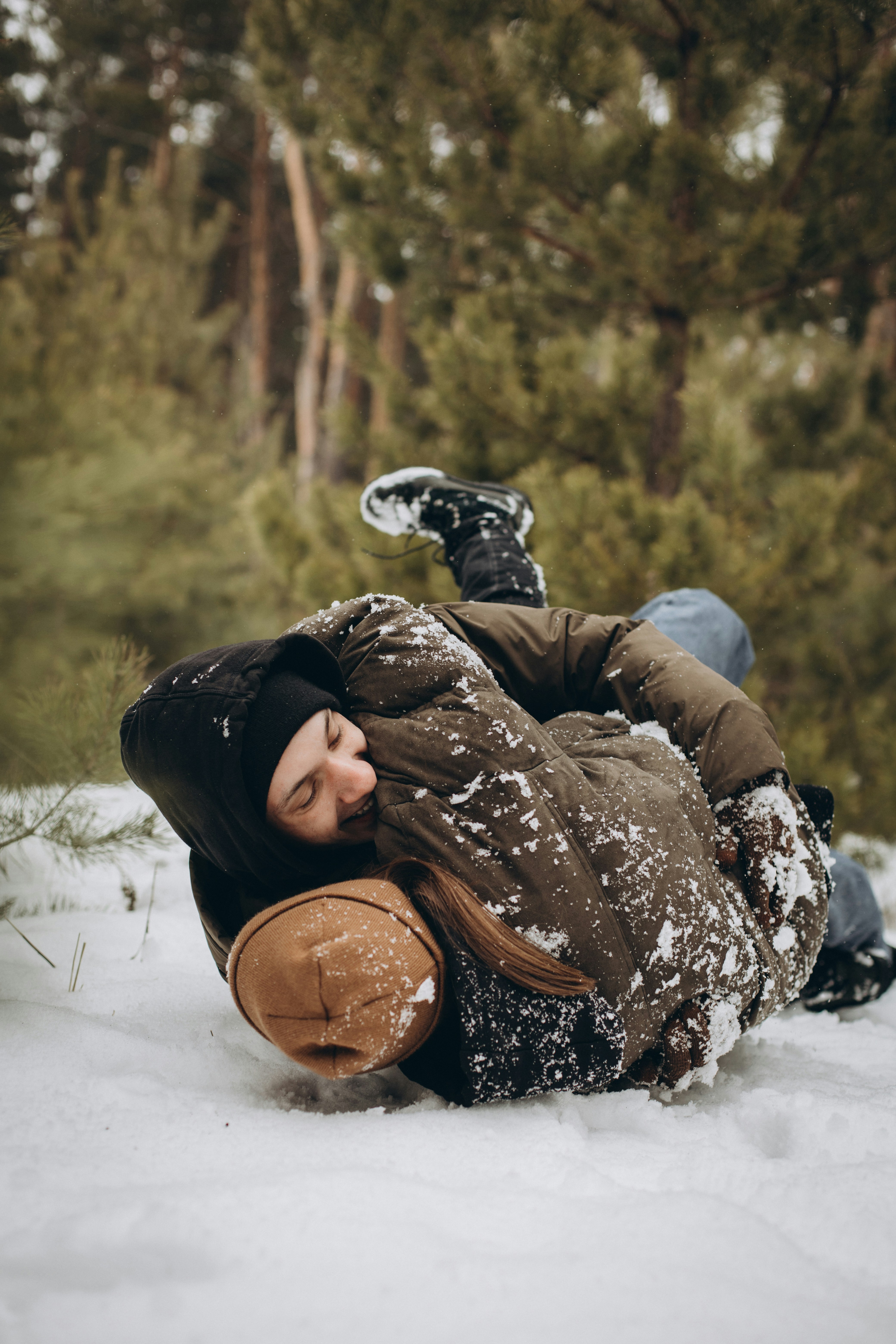 A person laying on the ground in the snow photo – Free Human Image on ...