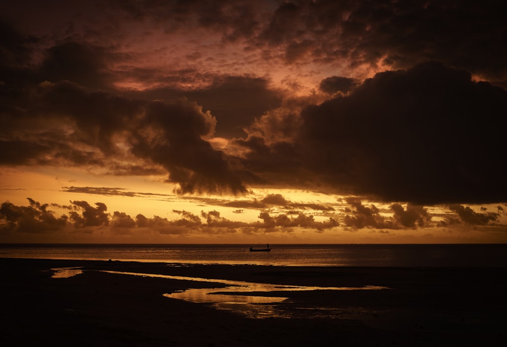 a sunset over a body of water