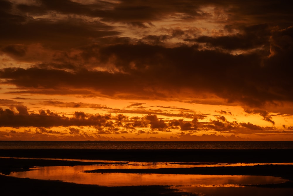 a sunset over a body of water