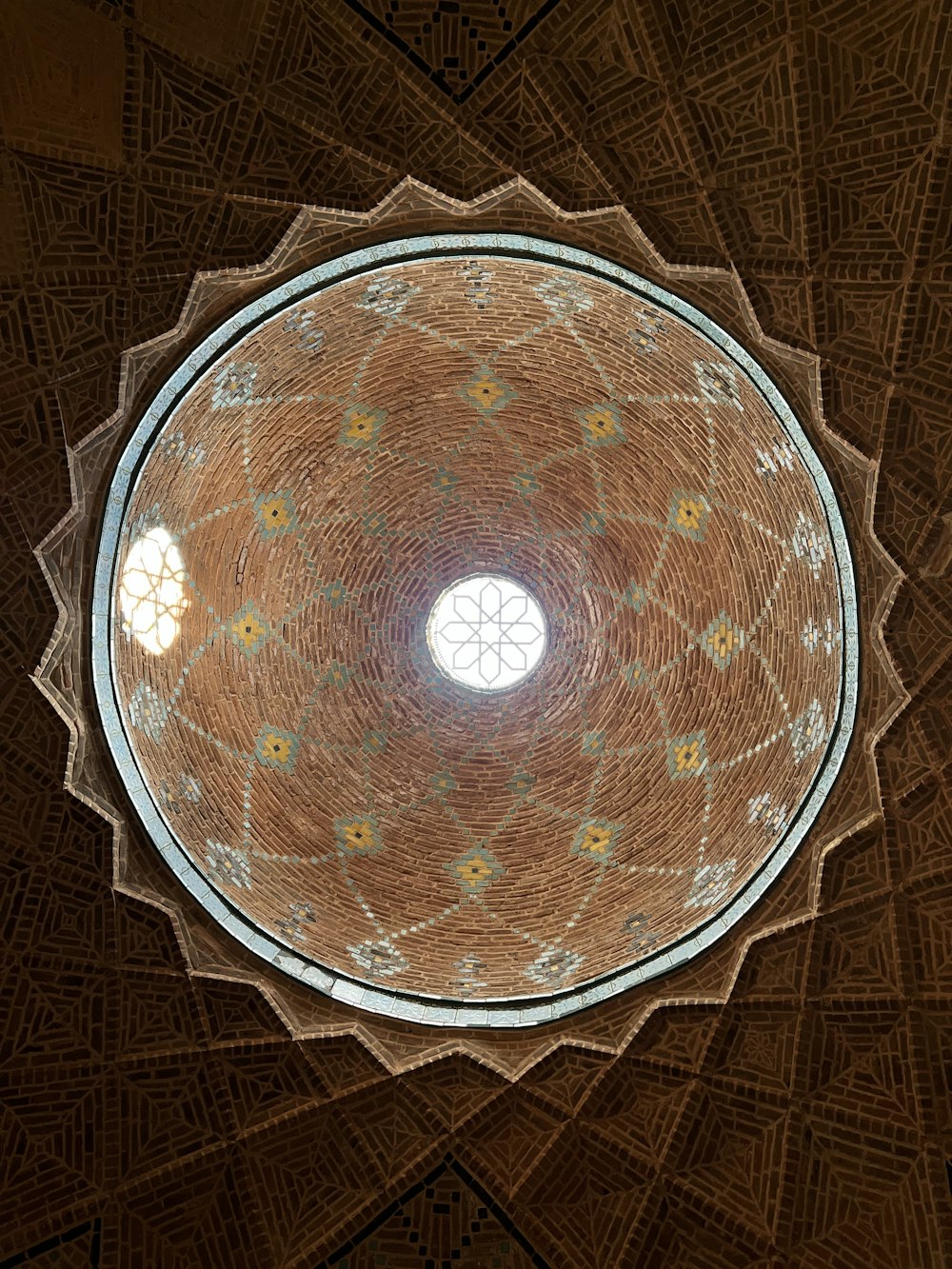a circular ceiling with a circular window in the center