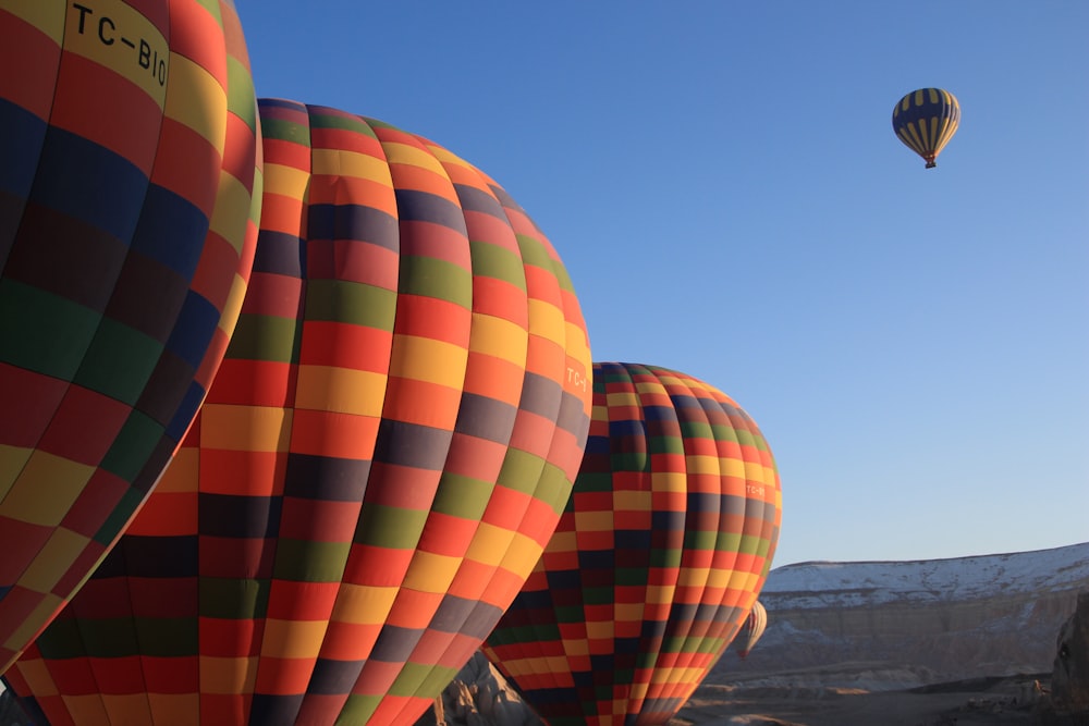 a group of hot air balloons flying in the sky