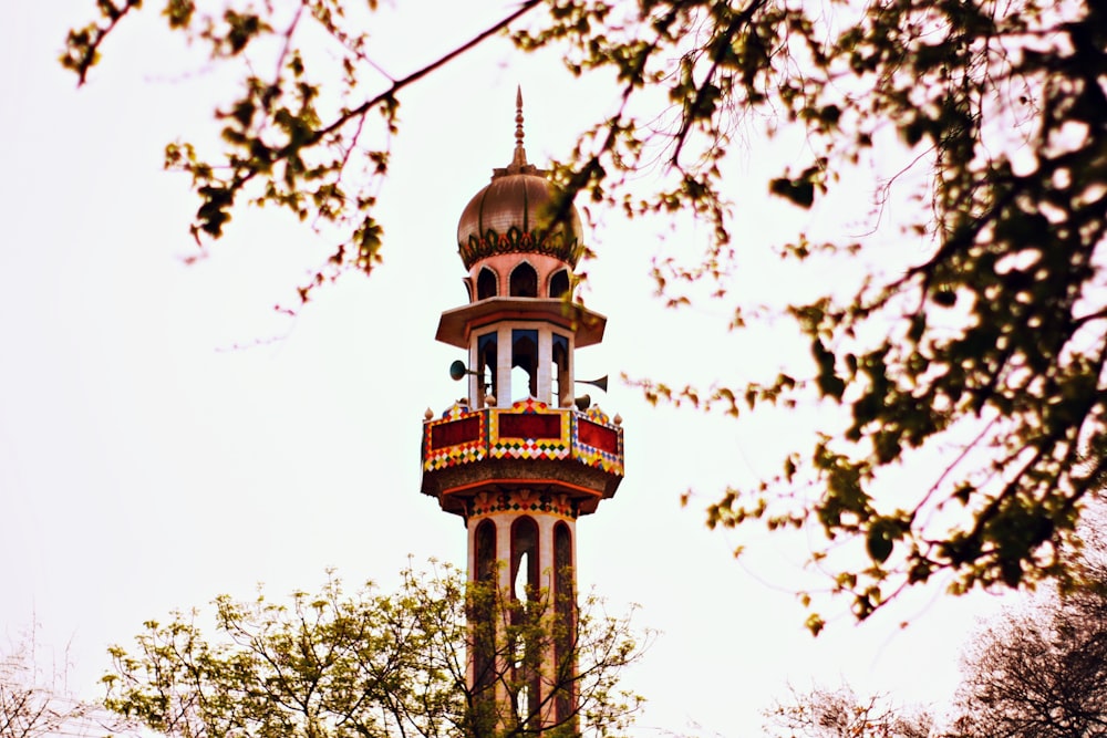 a tall tower with a clock on the top of it