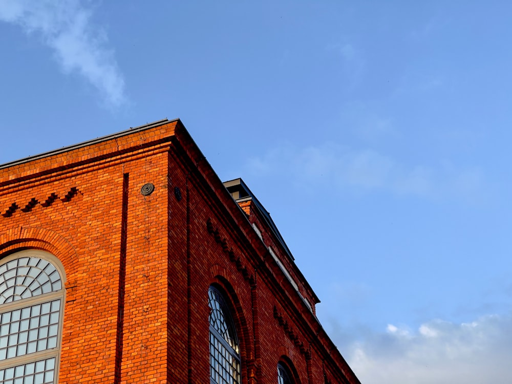 a red brick building with a clock on it