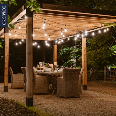 a patio with a table and chairs under a canopy